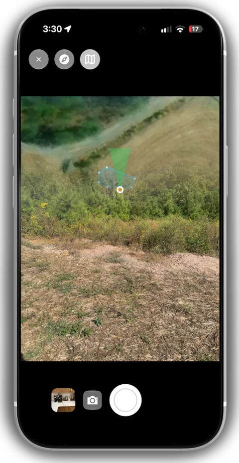 A phone camera viewfinder with a heading-up map overlaid.