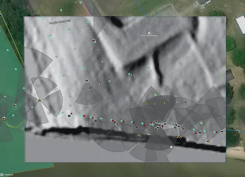 A hillshade layer over the project map, with photo view cones plotted on it.