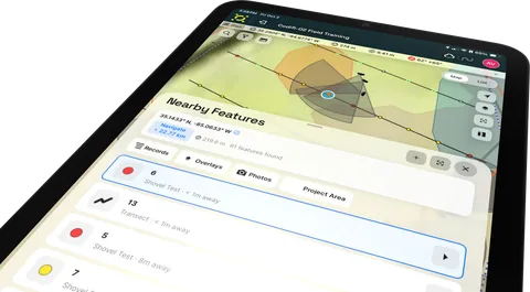 A tablet listing nearby records, overlays and photos by distance.