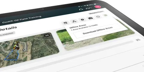 A tablet downloading an offline map area for a project.