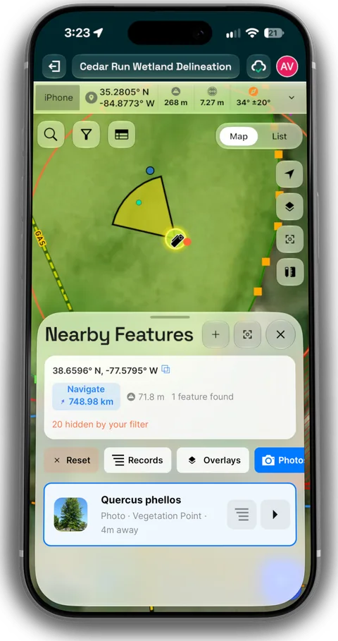 A phone showing a photo's location and view cone on the project map.